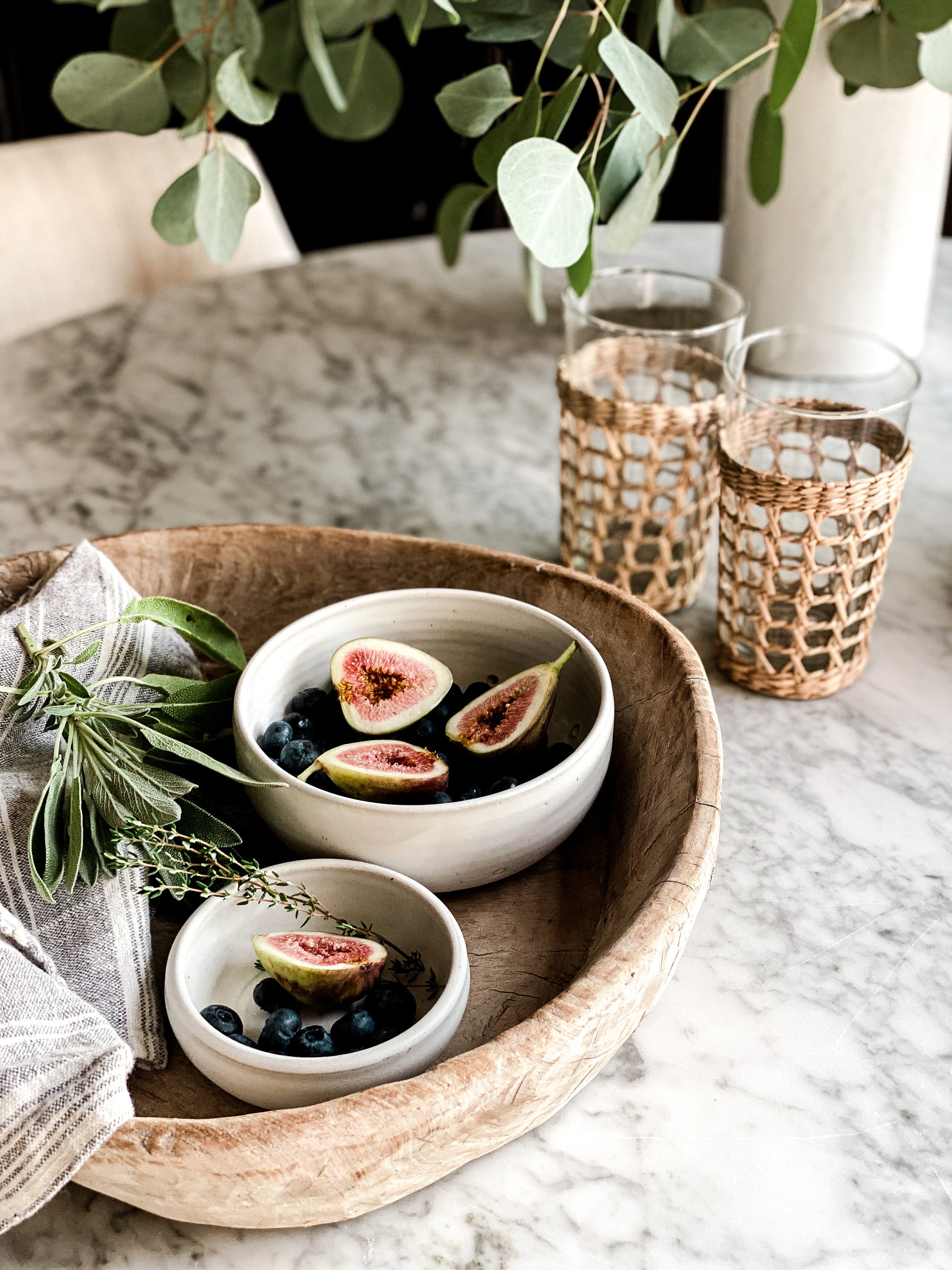 greige design shop + interiors handmade pottery seagrass wraped glasses