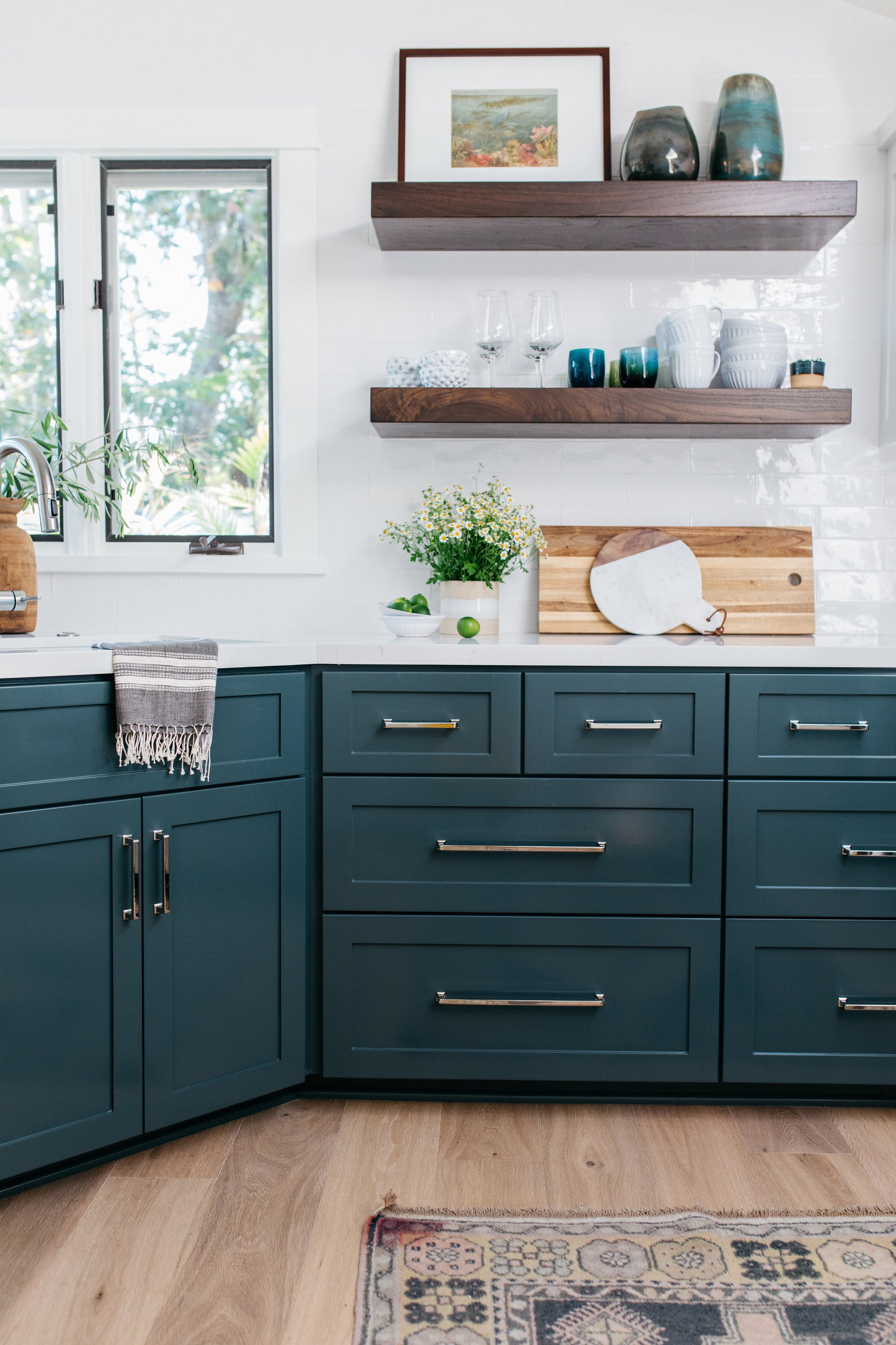 greige design shop + interiors kitchen with dark blue green cabinets and white counter tops laguan beach california design