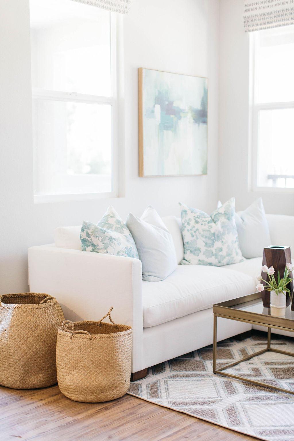 greige design shop + interiors orange county interior designer woven baskets custom pillows artwork and accessories